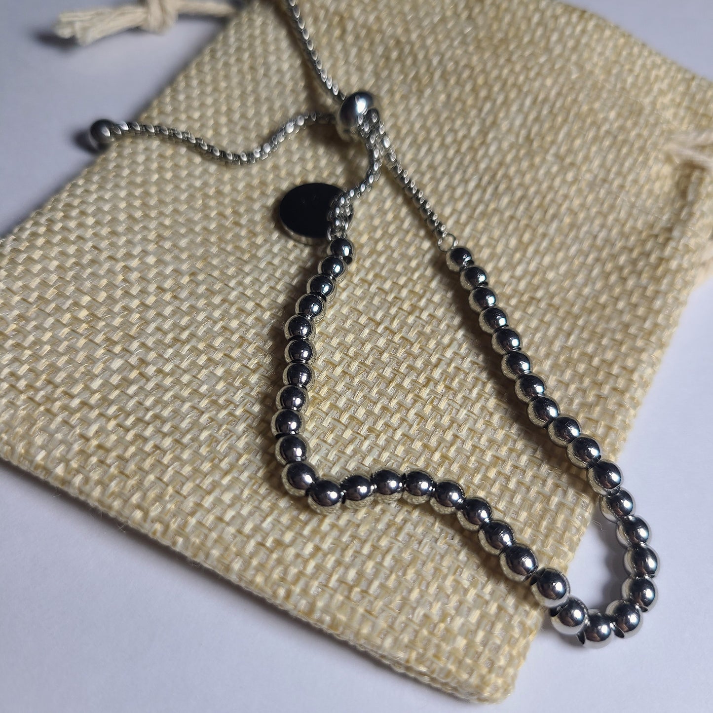 Pulsera colgante plateada | Acero quirúrgico