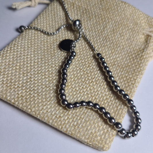 Pulsera colgante plateada | Acero quirúrgico